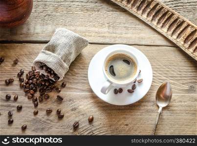 Cup of coffee with coffee beans