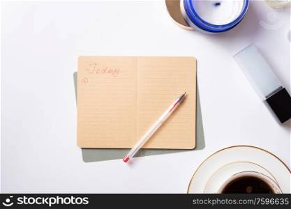 cup of coffee with diary, and care cosmetics around white background. life style flat lay