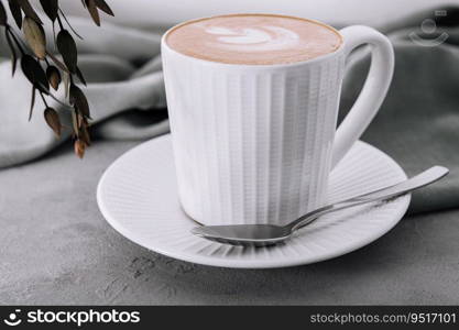 Cup of coffee with heart flower painted on foam