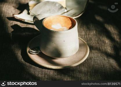 Cup of coffee with vintage film filter,shallow Depth of Field,Focus on coffee foam.. Cup of coffee with vintage film filter.