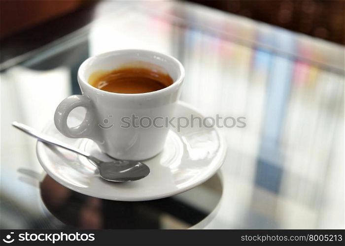 Cup of espresso coffee on the table