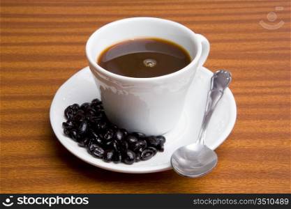 Cup of expresso coffee on a wooden table