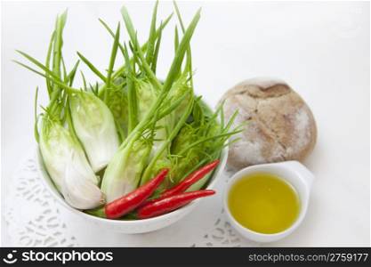 cup of fresh chicory, red pepper and oil
