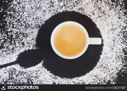 cup of fresh coffee espresso with foam, top view