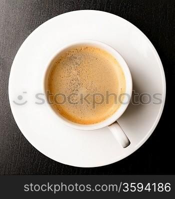 cup of fresh espresso on table, view from above