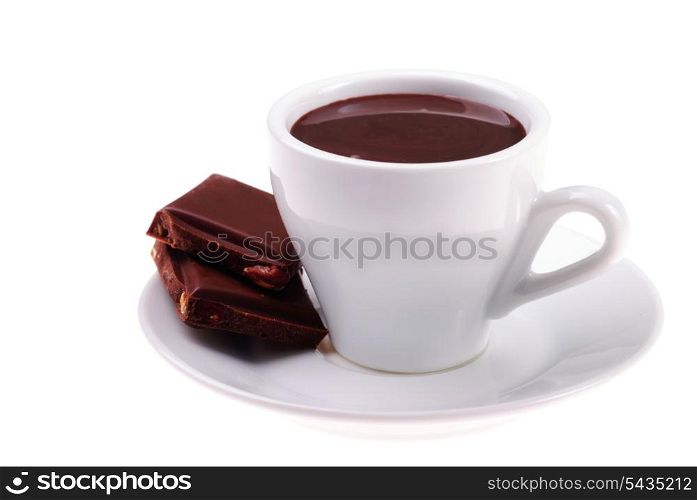 cup of hot chocolate and sliced dessert with hazelnuts isolated on white background
