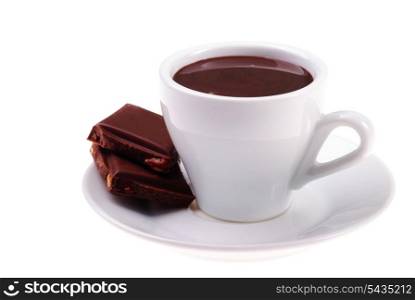 cup of hot chocolate and sliced dessert with hazelnuts isolated on white background