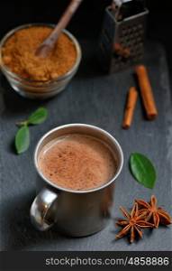 Cup of hot chocolate, cinnamon sticks and Coconut palm sugar