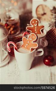 Cup of hot cocoa drink with cookie and candy. Christmas dessert. The Christmas dessert