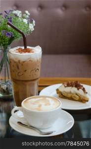 Cup of hot Coffee with Banoffee pie and ice coffee. coffee and pie