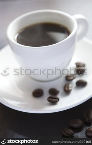 Cup Of Hot Coffee With Coffee Beans