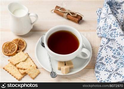 Cup of hot tea and cookies. Cup of hot tea and cookies on wooden background