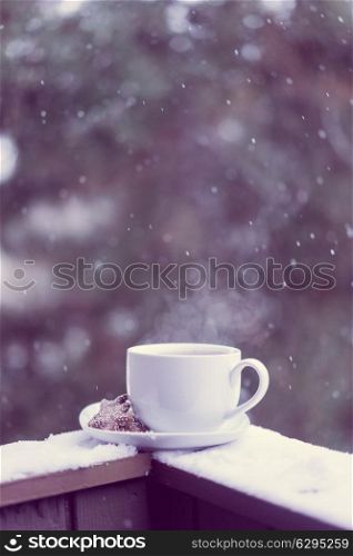 Cup of hot tea and cookies outside