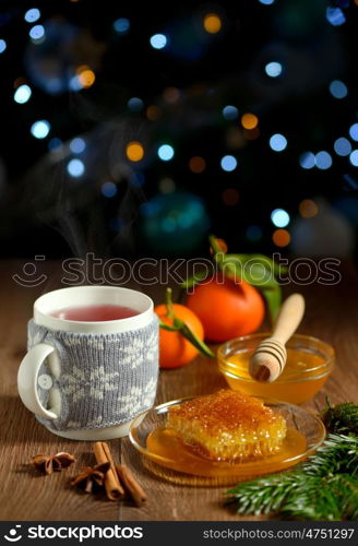 cup of hot tea with honey and winter spices