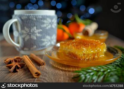 cup of hot tea with honey and winter spices
