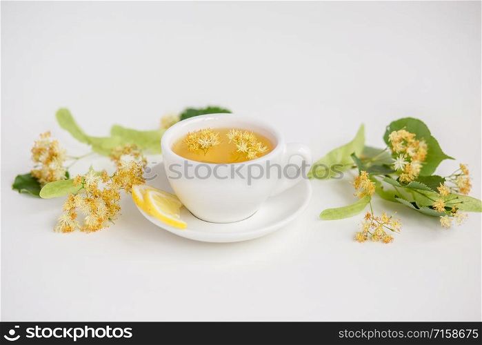 Cup of hot tea with sacking on the wooden table and the tea plantations background. Cup of hot tea with sackingCup of hot tea with sacking on the wooden table