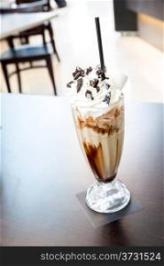Cup of iced mocha coffee with whipping cream