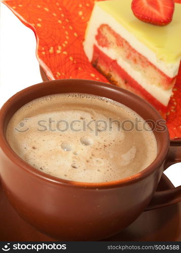 Cup of latte coffee with cake