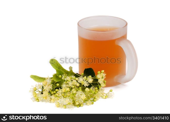 Cup of linden tea and linden blossom