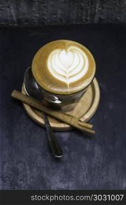 Cup of piccolo latte coffee with latte art. Cup of piccolo latte coffee with latte art, stock photo
