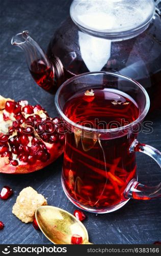 Cup of pomegranate tea. Cupful with turkish winter tasty tea with pomegranate