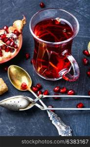 Cup of pomegranate tea. Cupful with turkish winter tasty tea with pomegranate