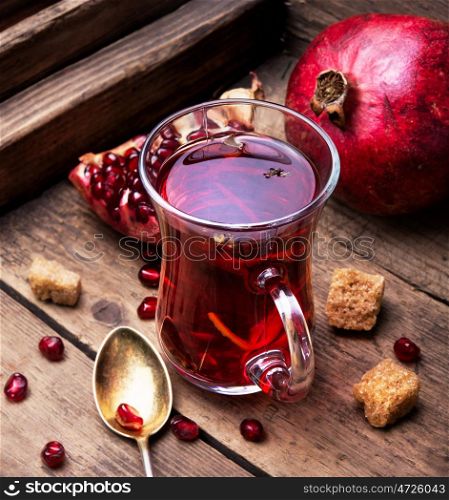 Cup of pomegranate tea. turkish winter tasty tea with pomegranate seeds