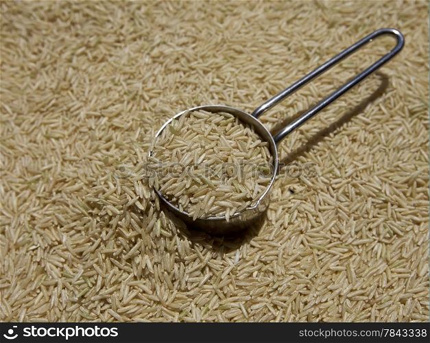 Cup of raw brown rice, uncooked staple