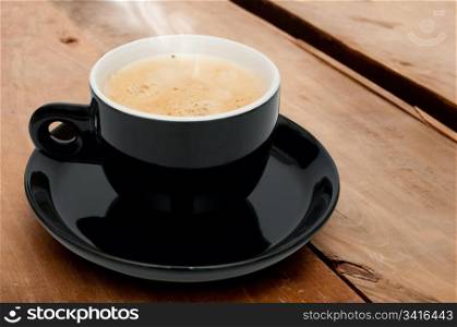 Cup of Smoking Espresso Coffee on Wooden Table