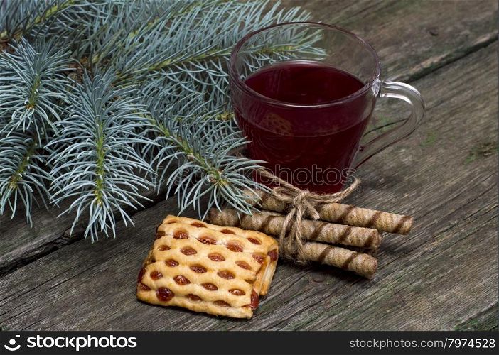 cup of tea a fir-tree branch and cookies
