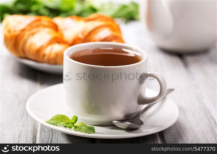 cup of tea and croissants