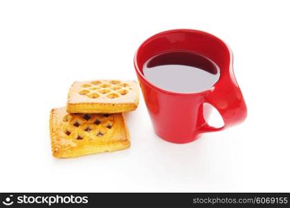 Cup of tea and fresh cookies on table