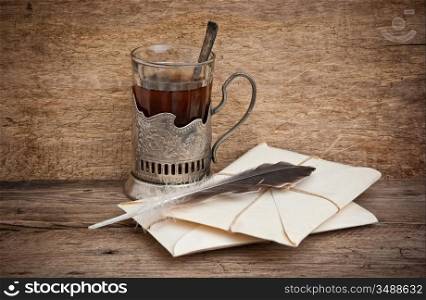 cup of tea and mail envelopes