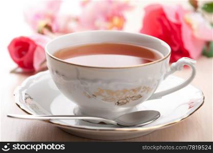 cup of tea and roses