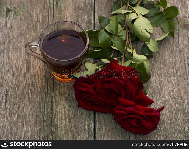 cup of tea and three red beautiful roses, still life, card, subject drinks