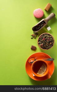 cup of tea at green surface background