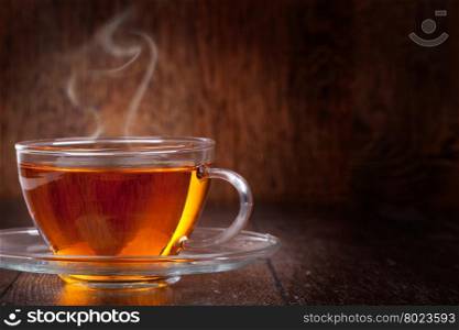 Cup of tea. Cup of tea on a wooden background