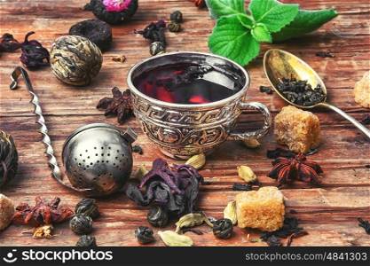 Cup of tea,dry tea leaves of different varieties and spices