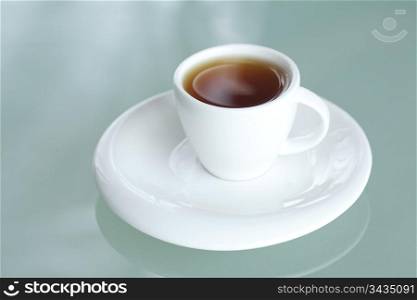 cup of tea on a glass surface