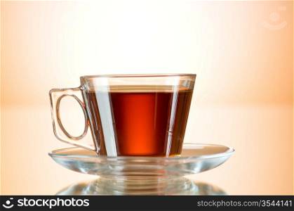 Cup of tea on the reflective surface