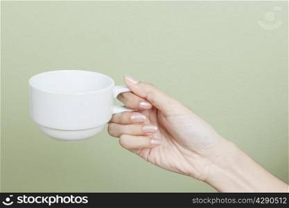 cup of tea or coffee in hand