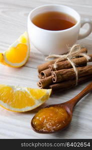 Cup of tea served with orange jam