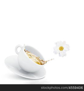 Cup of tea. White cup of chamomile tea against white background