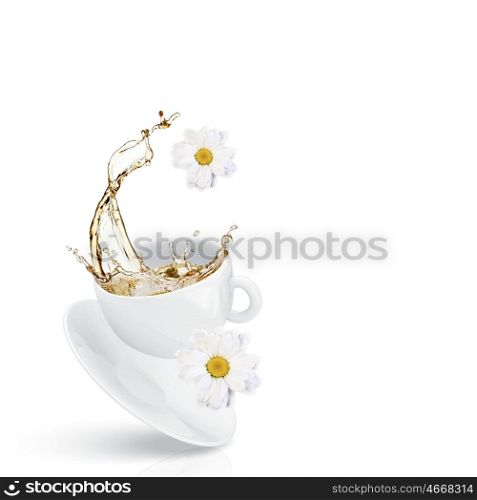 Cup of tea. White cup of chamomile tea against white background