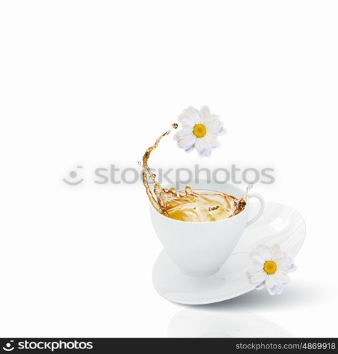 Cup of tea. White cup of chamomile tea against white background