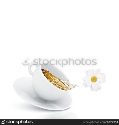 Cup of tea. White cup of chamomile tea against white background