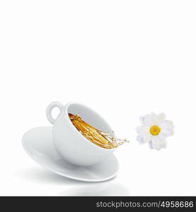 Cup of tea. White cup of chamomile tea against white background