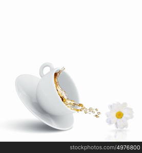 Cup of tea. White cup of chamomile tea against white background