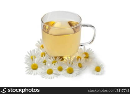 Cup of tea with chamomile flowers on white background