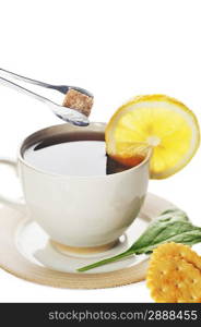 cup of tea with lemon and sugar